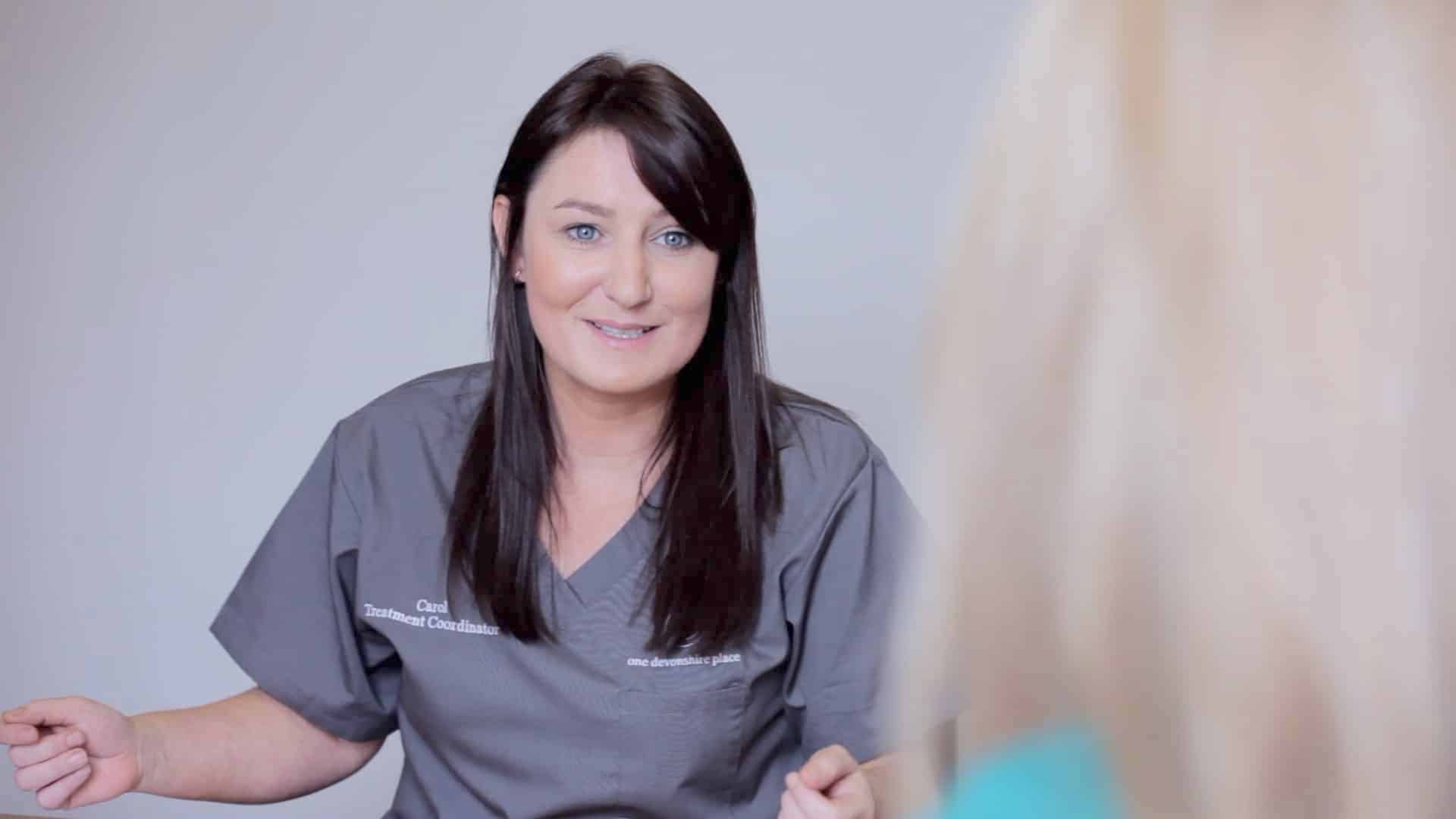 Dental nurse discussing lingual braces